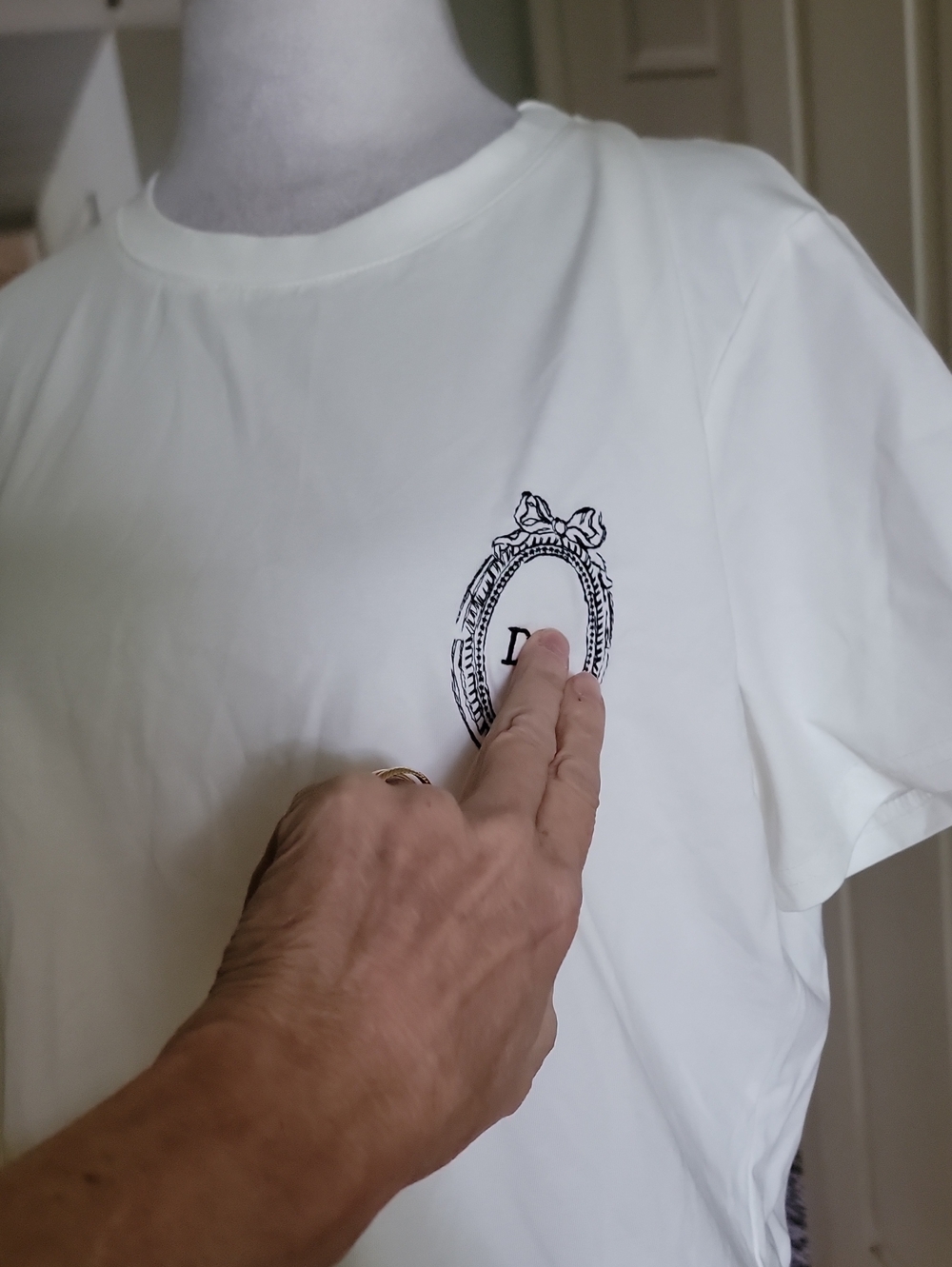 Inspired White Crewneck T-Shirt with Embroidered Crest